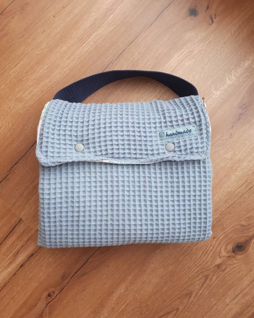 Changing pad and diaper bag